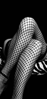 Black and white fishnet stockings on a zebra-patterned chair.