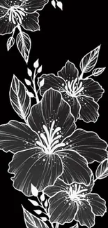 Elegant black wallpaper with white floral design.