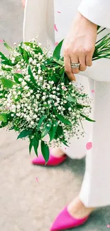 Elegant bouquet with green and white florals and pink heels, for mobile wallpaper.