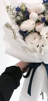 Elegant bouquet of white and blue flowers.