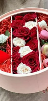 Elegant round floral box with roses and macarons.