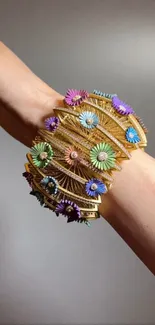 Colorful floral bracelet on a wrist, showcasing elegance and style.