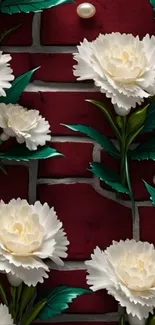 White flowers with green leaves on dark red brick.