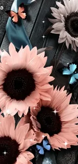 Peach sunflowers with blue butterflies on a dark wooden background.