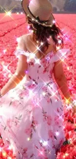 Woman in floral dress in pink tulip field with sparkles.