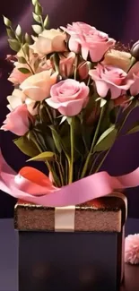 Pink roses bouquet in a gift box with ribbons