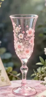 Glass adorned with delicate pink floral designs.