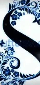 Black letter 'S' with blue floral design on white background.