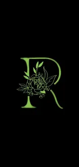 Floral letter R with a green design on black background.