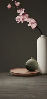 Minimalist wallpaper with vase and pink flowers on a wooden base.