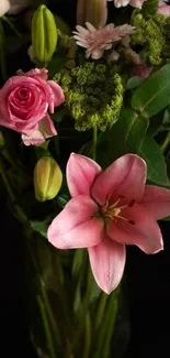 Beautiful pink and green floral arrangement on a dark background.