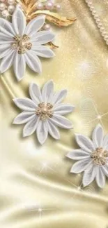 Elegant mobile wallpaper with white flowers and pearls on a gold background.