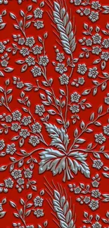 Elegant red wallpaper with intricate white floral pattern.