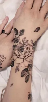 Floral tattoo design on forearm, elegant art.