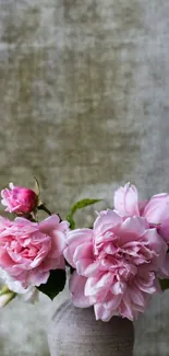 Pink flowers in a rustic vase against a textured green background mobile wallpaper.