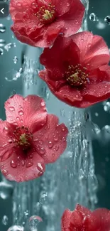 Red flowers with water droplets against a teal green waterfall background.