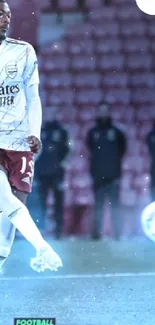 Football player performing a kick in a brightly lit stadium scene.