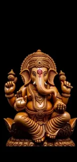 Intricate Ganesha statue on a black background, showcasing detailed craftsmanship.