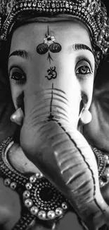 Black and white Ganesha statue with ornate decorations.