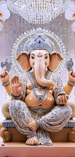 Ganesha statue with ornate decoration and orchids