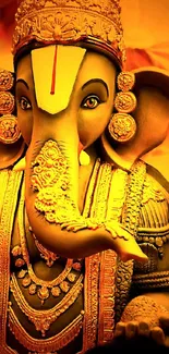 Intricately designed gold Ganesha statue wallpaper on mobile.