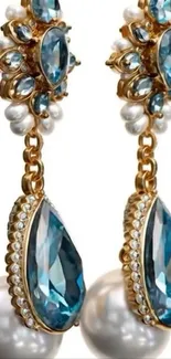 Elegant earrings with blue gemstones and pearls.