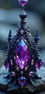 Ornate black and purple gemstone ornament on a wooden surface.