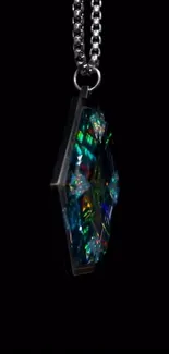 Colorful gemstone pendant against a dark background.