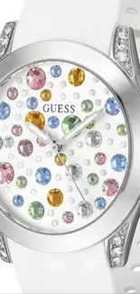 Elegant wristwatch with colorful gemstones and silver design.