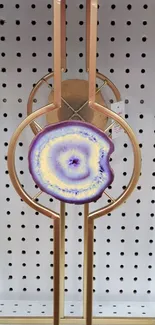 Purple and gold geode art on pegboard wallpaper