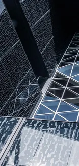Modern geometric glass facade with reflections.