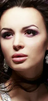 Glamorous woman with sparkling earrings and purple backdrop.