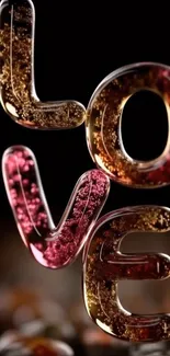 Glass letters spelling LOVE in elegant, modern design.