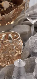 Elegant glassware on a festive table setting with a beige backdrop.