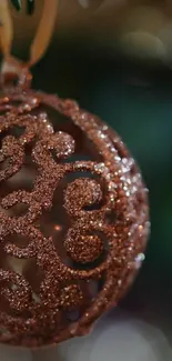 Close-up of a glittering bronze holiday ornament.