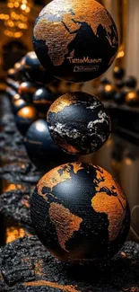 Elegant globes in black and orange hues decorate this stylish mobile wallpaper.