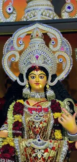 An ornate goddess statue with vibrant colors and intricate details.