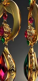 Ornate gold earrings with red and green gemstones on display.