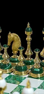 Luxurious gold and green chess set mobile wallpaper.