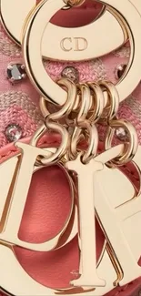 Close-up of gold and pink charms with luxurious texture.