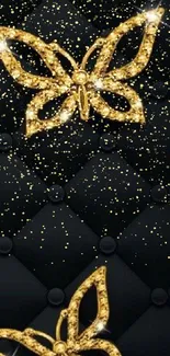 Luxury quilted black wallpaper with gold butterflies.