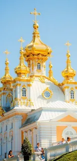 Elegant gold-domed church against a sky backdrop wallpaper.