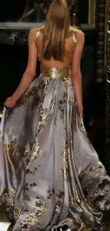 Elegant gold evening gown with intricate designs in a luxurious setting.