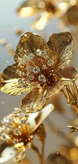 Intricately designed gold flower with sparkling details on a mobile wallpaper.