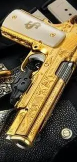 Luxurious gold pistol with intricate design on decorative surface.