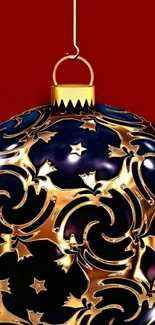 Golden ornament with intricate patterns on red background.