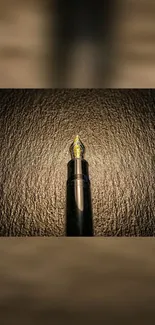 Elegant dark gold fountain pen on textured background.