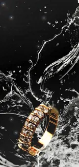 Gold ring amid a water splash against a black background.