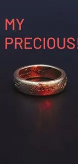 Gold ring wallpaper with red lighting on dark background.