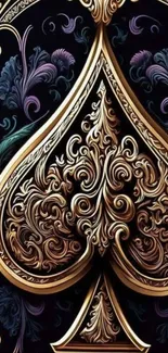 Intricate gold spade with ornate details on a dark background.